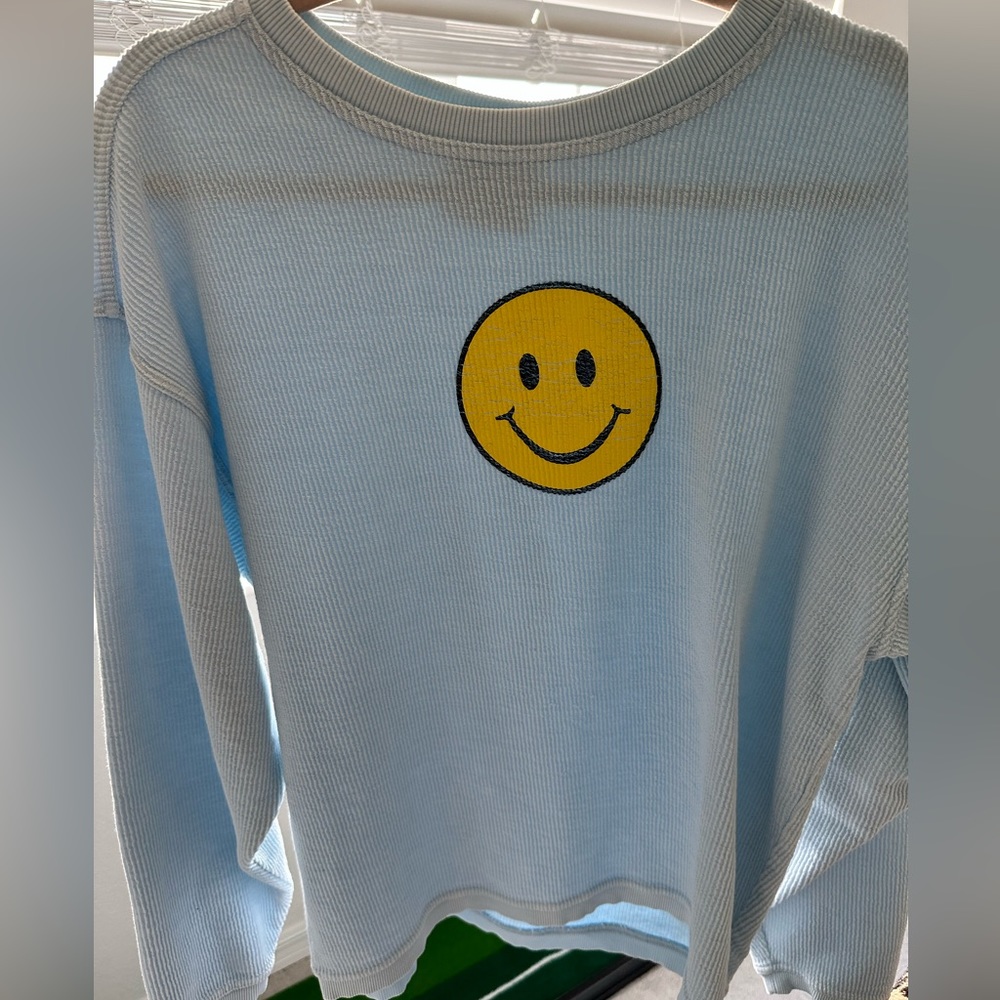 Shop Darling Corded Smiley Face Sweatshirt